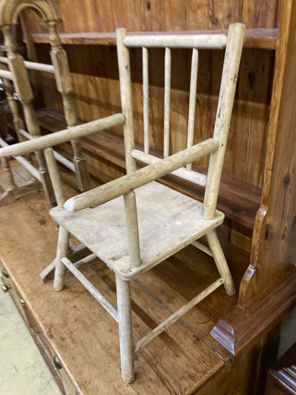 A Victorian towel rail, a primitive childs elbow chair and a metamorphic chair